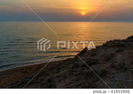 Sunset over the sea on wild beach of Persian gulf 41853906