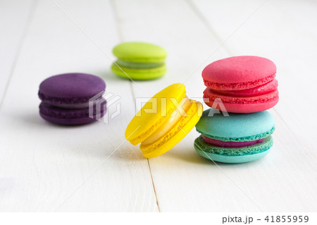 Colorful Macaroons on white wooden background. Colorful Macaroons on white wooden background. 41855959