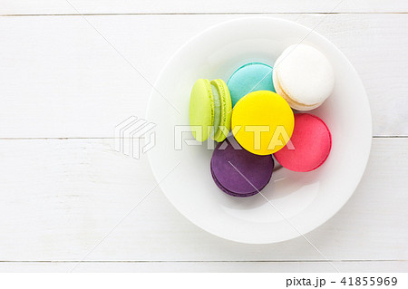 Colorful Macaroons on white wooden background. 41855969