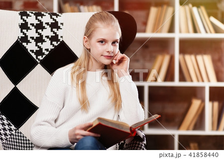 Teenage girl in a library 41858440