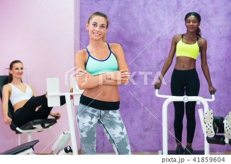 Portrait of beautiful woman working as fitness instructor in ladies only gym Portrait of beautiful woman working as fitness instructor in ladies only gym 41859604