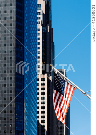 American flag waving against modern office building 41860601