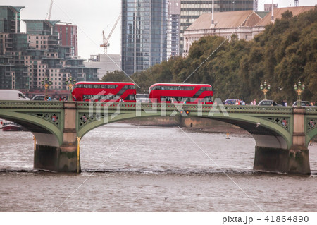 Red buses on Big Bens bridge in London, UK Red buses on Big Bens bridge in London, UK 41864890