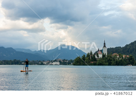 stand up paddle boarding on the lake stand up paddle boarding on the lake 41867012