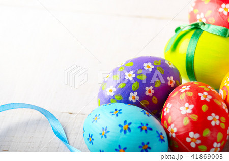 Painted decorated easter eggs on white table Painted decorated easter eggs on white table 41869003