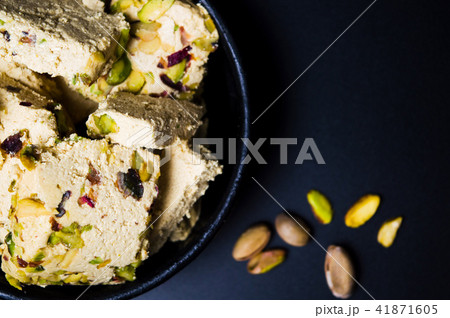 Halva with pistachio on dark background 41871605