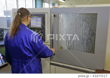 Woman in uniform in production Woman in uniform in production 41873517