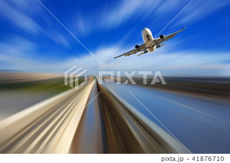 Airliner over highway on blurred background 41876710