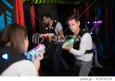 Excited guy during lasertag game 41879119