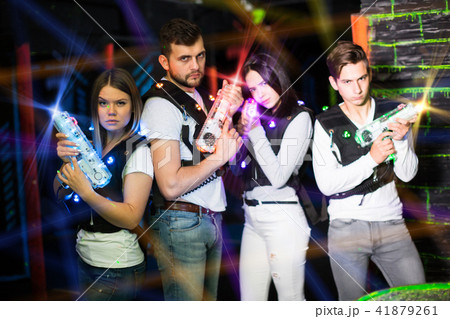 Friends with laser guns in colored beams Friends with laser guns in colored beams 41879261