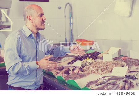 customer buying chilled seafood 41879459