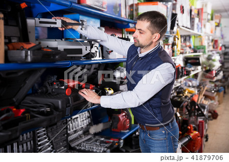 Man choosing grinding machine Man choosing grinding machine 41879706
