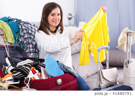 Woman packing for holiday Woman packing for holiday 41880791