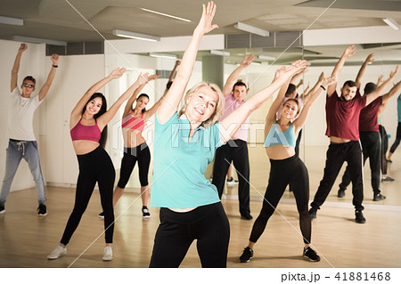 men women posing in fitness studio 41881468