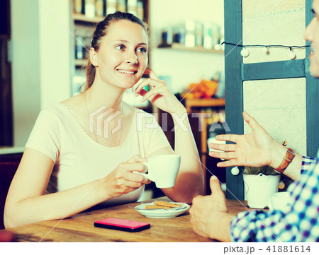 Cheerful young female talking with male 41881614