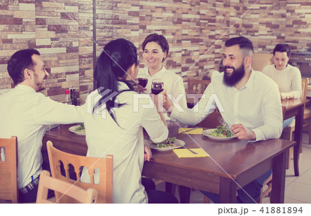 Group of people dining out in restaurant 41881894
