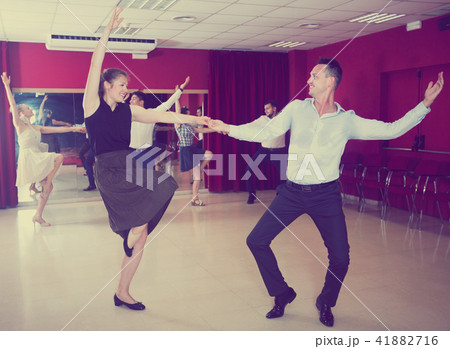 Couples enjoying active boogie-woogie Couples enjoying active boogie-woogie 41882716