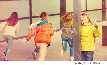 Group of happy children playing at Hide-and-seek Group of happy children playing at Hide-and-seek 41882727