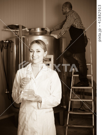 Two brewery workers on beer factory. Two brewery workers on beer factory. 41882913