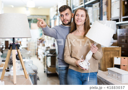 Couple choosing table lamp Couple choosing table lamp 41883037