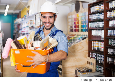foreman holding basket with tools 41883736
