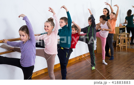 cheerful children rehearsing ballet dance in studio cheerful children rehearsing ballet dance in studio 41883883