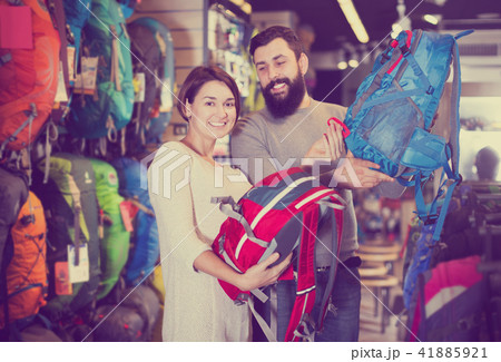 Couple choosing rucksack in store 41885921