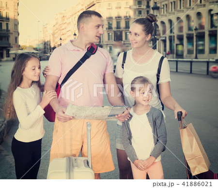 Nice family of four visiting sights with map 41886021
