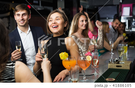 Females and males celebrating corporate 41886105