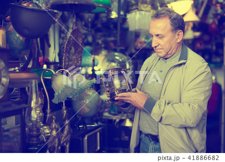 Middle aged man buying retro handicrafts Middle aged man buying retro handicrafts 41886682
