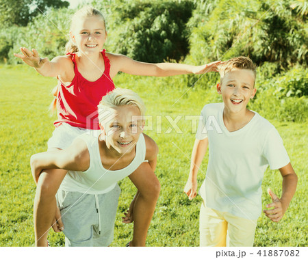 Laughing kids running on grass Laughing kids running on grass 41887082