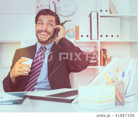 Smiling businessman is talking phone with his partner 41887106