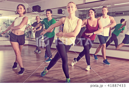 Glad positive people learning zumba steps Glad positive people learning zumba steps 41887433