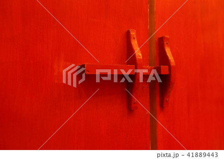 Red wooden door latch and lock in traditional Thai 41889443