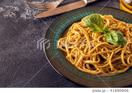Pasta with homemade pesto sauce. 41890606