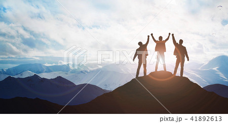 Silhouette of the team on the peak of mountain Silhouette of the team on the peak of mountain 41892613