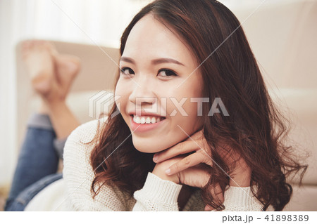Pretty woman resting at home 41898389