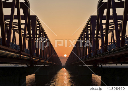 木曽川大橋と日の出の写真素材