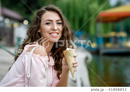 young smiling girl with ice cream 41898852