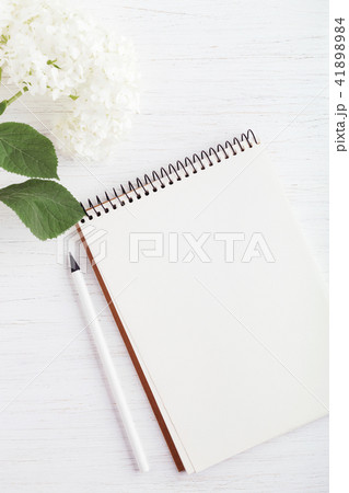 Notebook, pencil and flower. Notebook, pencil and flower. 41898984