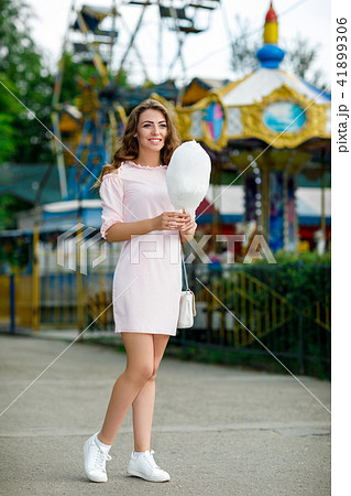 attractive woman holding sweet cotton candy 41899306