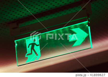 Illuminated green emergency exit sign 41899627