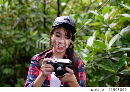 Travel concept. Asian girls are traveling in the woods. Beautif Travel concept. Asian girls are traveling in the woods. Beautif 41903066
