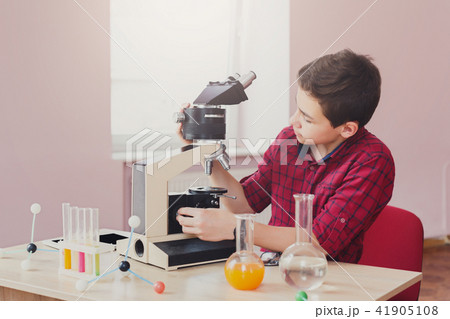 Stem education. Teenage boy make chemical research Stem education. Teenage boy make chemical research 41905108