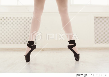 Ballerina in pointe shoes, graceful legs, ballet background Ballerina in pointe shoes, graceful legs, ballet background 41905585