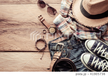 Travel accessories and costume on wooden floor Travel accessories and costume on wooden floor 41905736