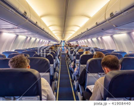 Saloon aircraft with passengers during the flight. Saloon aircraft with passengers during the flight. 41908440