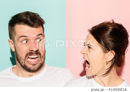 attractive angry couple fighting and shouting at each other attractive angry couple fighting and shouting at each other 41908858
