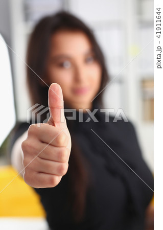 young pretty brunette woman show big finger closeup 41911644