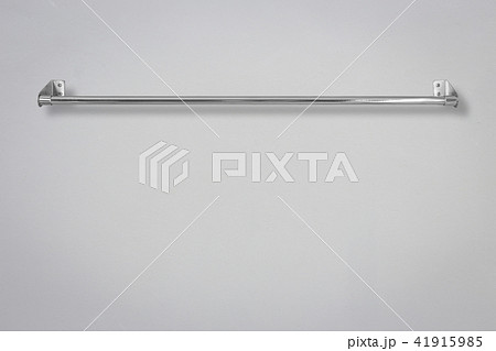 Stainless steel towel on grey cement wall 41915985